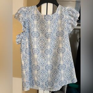 Large SHEIN Blue and White Patterned Women's Top with ruffle sleeve detail.